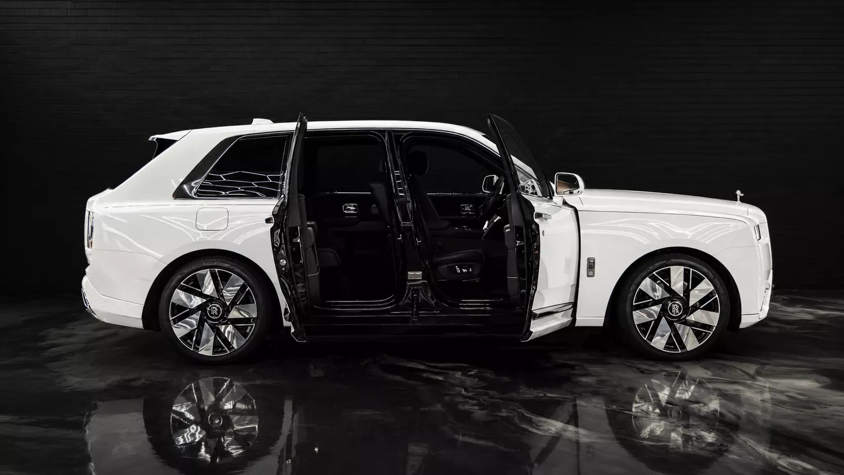 Open door view of a Rolls-Royce Cullinan Series II luxury SUV for hotel guest transport in Sydney