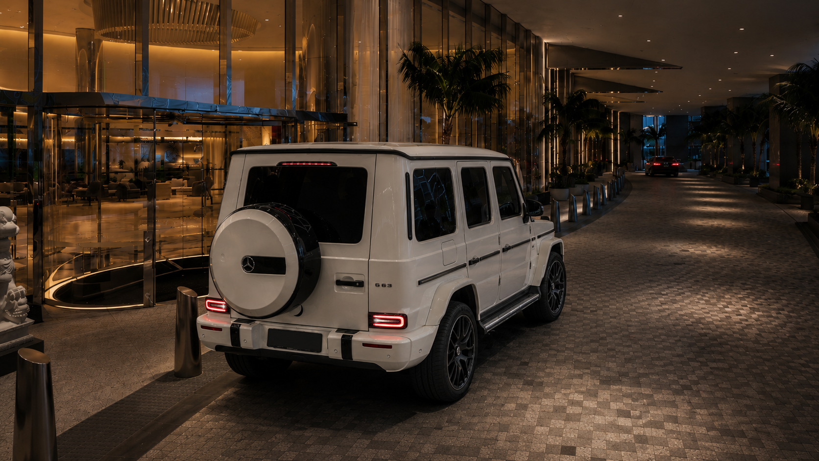 Private hotel guest transport in Sydney with a Mercedes G-Class at a luxury hotel entrance